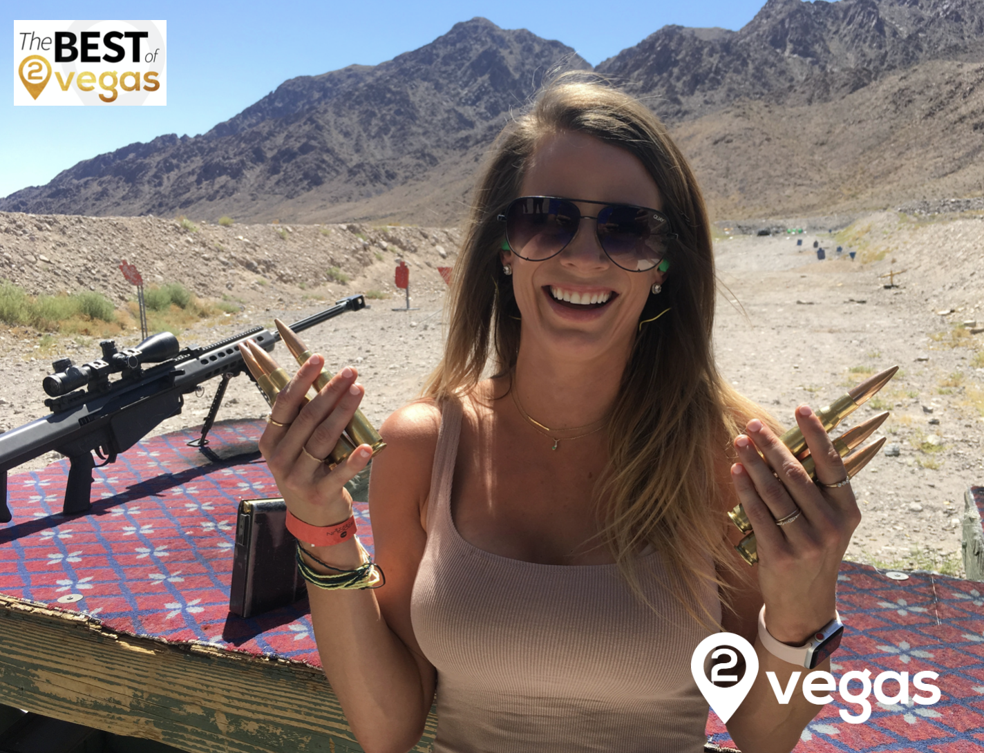 Guest posing with the 50 Cal sniper rifle and bullets